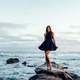 women-by-the-shore-in-black-dress