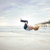 women-doing-a-backflip-on-the-beach