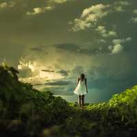 women-in-white-dress-under-clouds-in-the-landscape