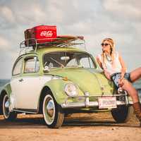 women-sitting-on-car