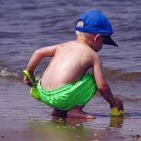 young-boy-playing-on-the-shore