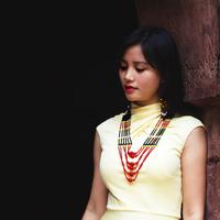 Young Girl in traditional dress and beads