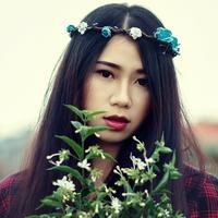 Young Girl with flower crown and white flowers