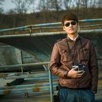 young-man-in-sunglasses-with-a-camera