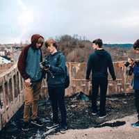 young-photographers-looking-at-cameras