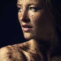 young-women-face-portrait-covered-in-dirt