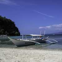 Puerto Galera with a boat in the sea