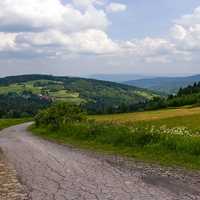 Mountains, sky, road, and clouds in Poland