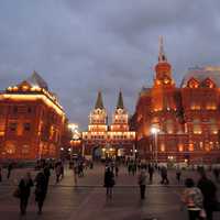 People walking around the square at night in Moscow, Russia