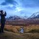 Man taking photo of the Majestic Mountains