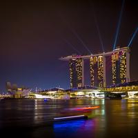 Triple towers and lights in cityscape of Singapore