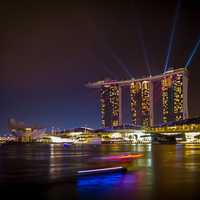Triple towers and lights in cityscape of Singapore