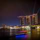 Triple towers and lights in cityscape of Singapore