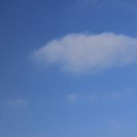 Sky with one light puffy cloud