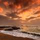 Seashore at dusk with waves and clouds in Nkwazi, South Africa