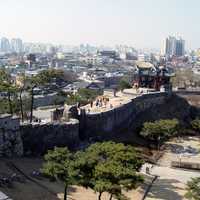 Hwaseong Fortress and the skyline of Suwon in South Korea
