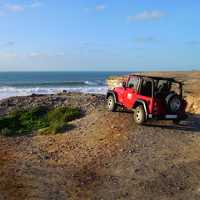 Jeep overlooking the ocean