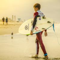 Boy Surfer heading to shore