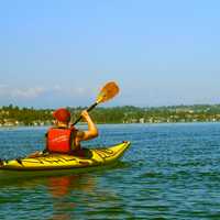Canoer paddling on a lake