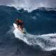 Surfer riding the wave on the ocean