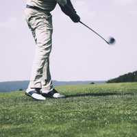 Golfer hitting a golf ball