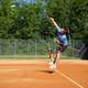 Man Hitting a Jump Shot in Tennis