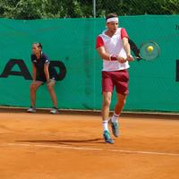Man Hitting a Volley Shot in Tennis