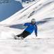 Man Skiing down a snowy mountain