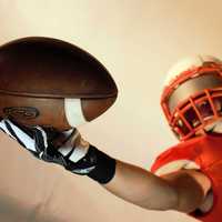 Player Catching Football 