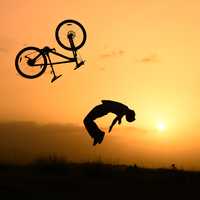Stunt Cyclist at Sunset 