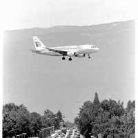 Airplane flying over Route de Meyrin, Switzerland