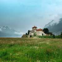 Castle on the end of a grassy field in Saint Moritz, Switzerland