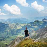 Man standing on the Alps at Interlaken, Switzerland