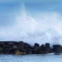 Waves crashing onto shore in Wanli Harbour in Taiwan