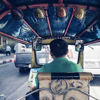 Man Driving a Cart in Bangkok, Thailand