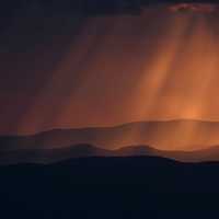 Red light shining down on hills in Ukraine