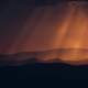 Red light shining down on hills in Ukraine