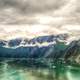 Landscape of mountains and Fjords under clouds around Juneau, Alaska