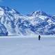 Frozen Crescent Lake landscape with mountains in the background