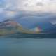 Rainbow coming out from the clouds in Lake Clark National Park