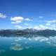 Reflections of mountains and clouds on Lake Clark