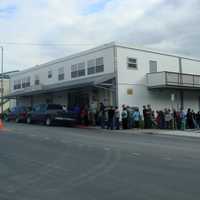 Customers line up in front of the Orpheum Theater in Kodiak, Alaska