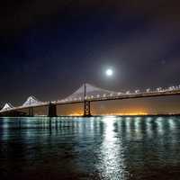 Moon and Stars over the Oakland-San Francisco Bay Bridge at night in California