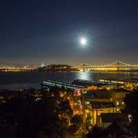 Night Time Cityscape view of Oakland-San Francisco Bay Bridge with sky and moon in California