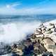 Big Waves Crashing onto rocky shore at King Tide