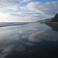 Black's Beach in California with clouds and water