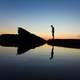 Man Standing on the shore at Laguna Beach, California