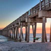 Hanging a Hammock above the waves off a bridge