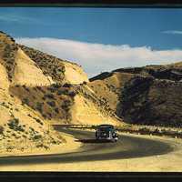 Road cut into the barren hills which lead into Emmett. Emmett, Idaho