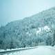 Snowy morning on the road in the hills landscape at Idaho Falls